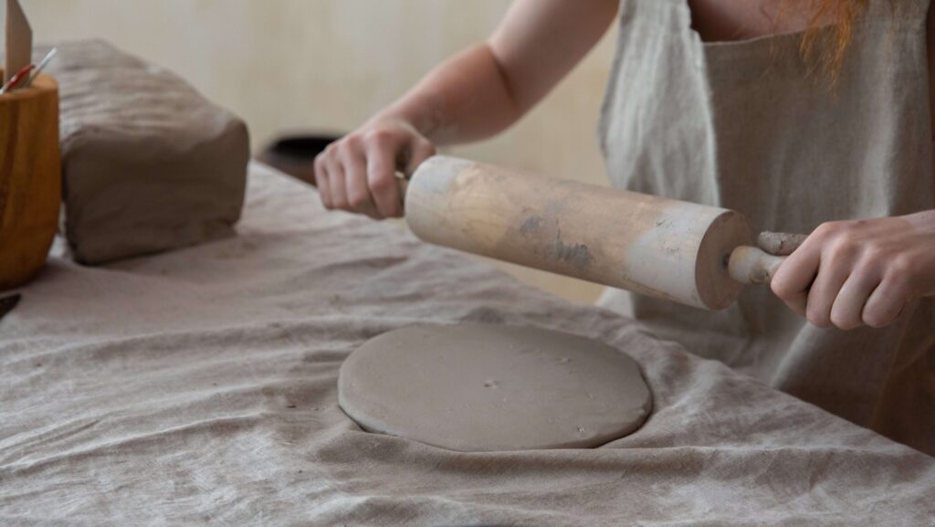 rolling out a pottery slab