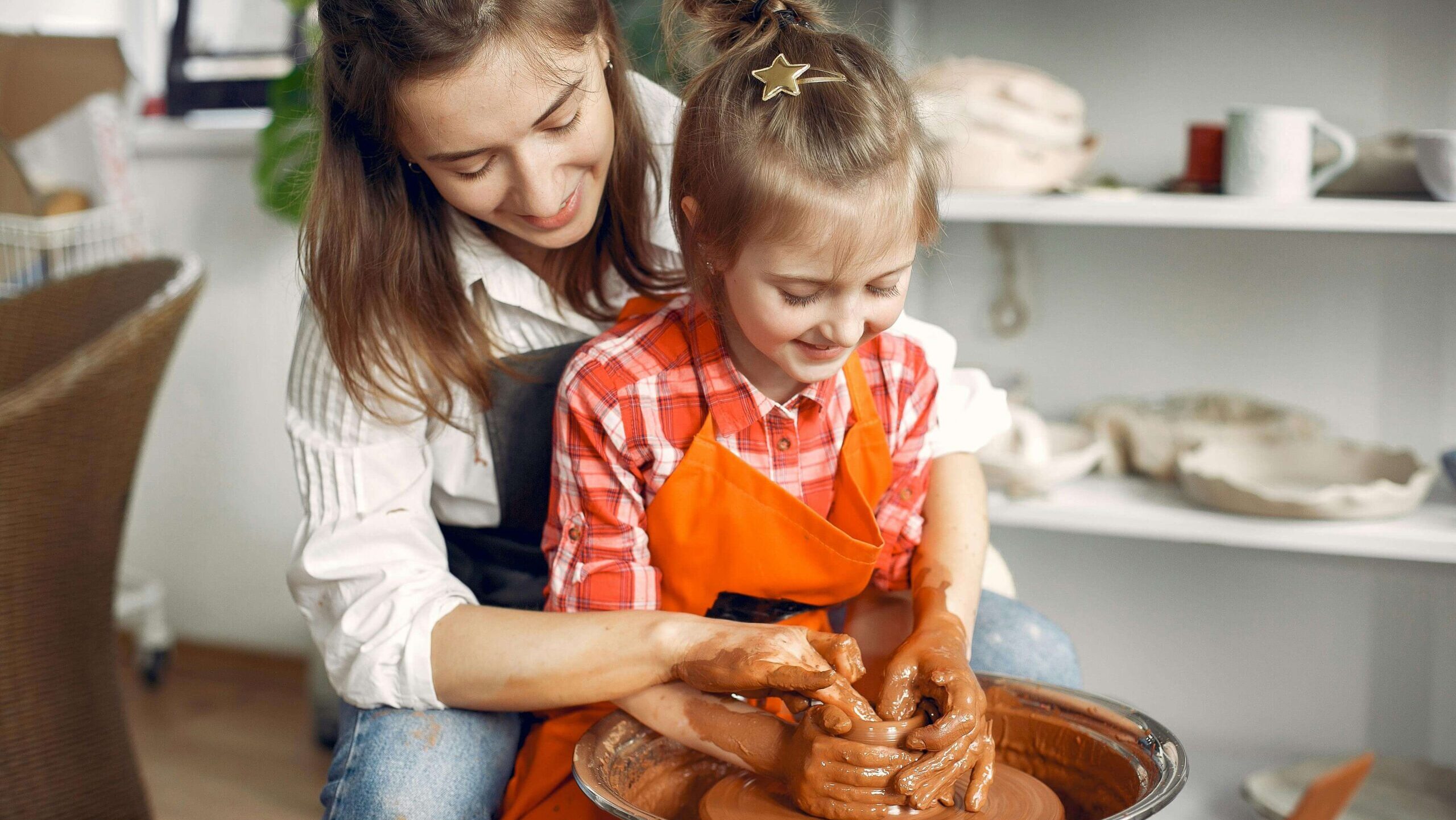 kid doing pottery
